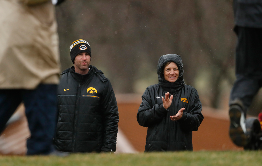 Iowa Men's Golf Head Coach Tyler Stith and Women's Golf Head Coach Megan Menzel watch the action during day two of the 2018 Hawkeye Invitational Friday, April 13, 2018 at Finkbine Golf Course. (Brian Ray/hawkeyesports.com)