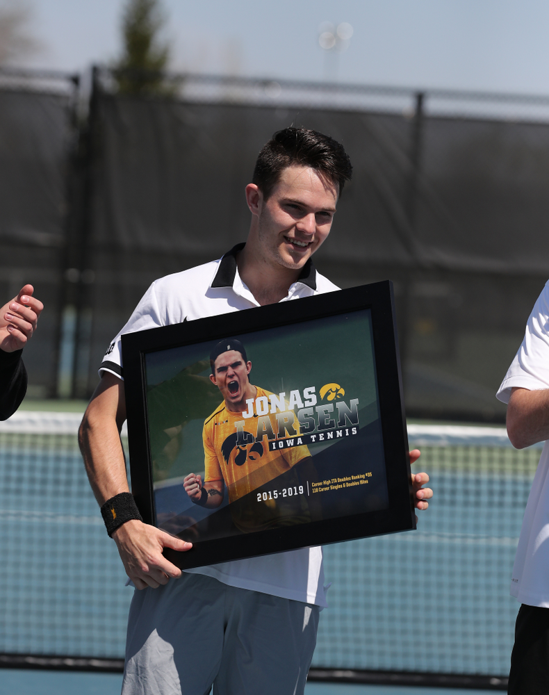 IowaÕs Jonas Larsen is honored during senior day ceremonies before their game against the Michigan Wolverines Sunday, April 21, 2019 at the Hawkeye Tennis and Recreation Complex. (Brian Ray/hawkeyesports.com)
