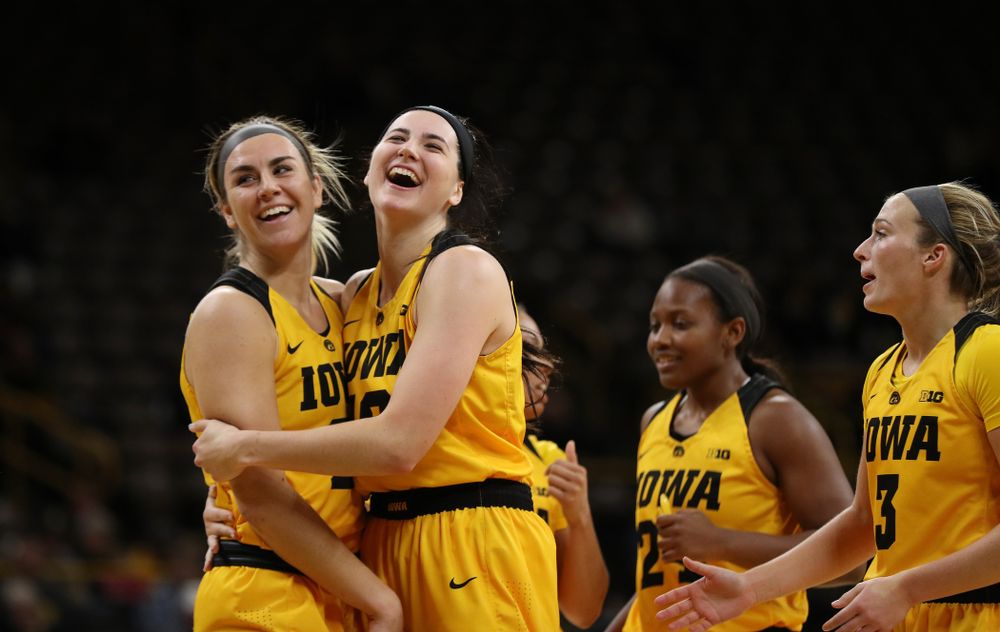 Iowa Hawkeyes forward Hannah Stewart (21) hugs forward Megan Gustafson (10) against the Robert Morris Colonials Sunday, December 2, 2018 at Carver-Hawkeye Arena. (Brian Ray/hawkeyesports.com)