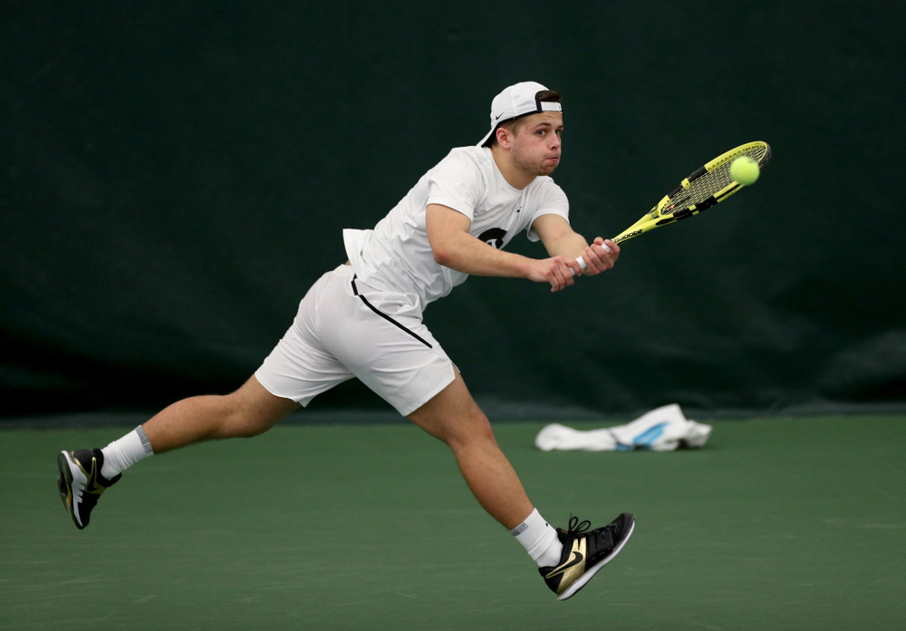 Iowa’s Will Davies against Cornell Sunday, March 8, 2020 at the Hawkeye Tennis and Recreation Center. (Brian Ray/hawkeyesports.com)