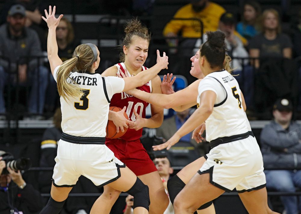 Iowa Hawkeyes guard Makenzie Meyer (3), forward Monika Czinano (25), and guard Alexis Sevillian (5) pressure Indiana Hoosiers forward Aleksa Gulbe (10) during the second quarter of their game at Carver-Hawkeye Arena in Iowa City on Sunday, January 12, 2020. (Stephen Mally/hawkeyesports.com)