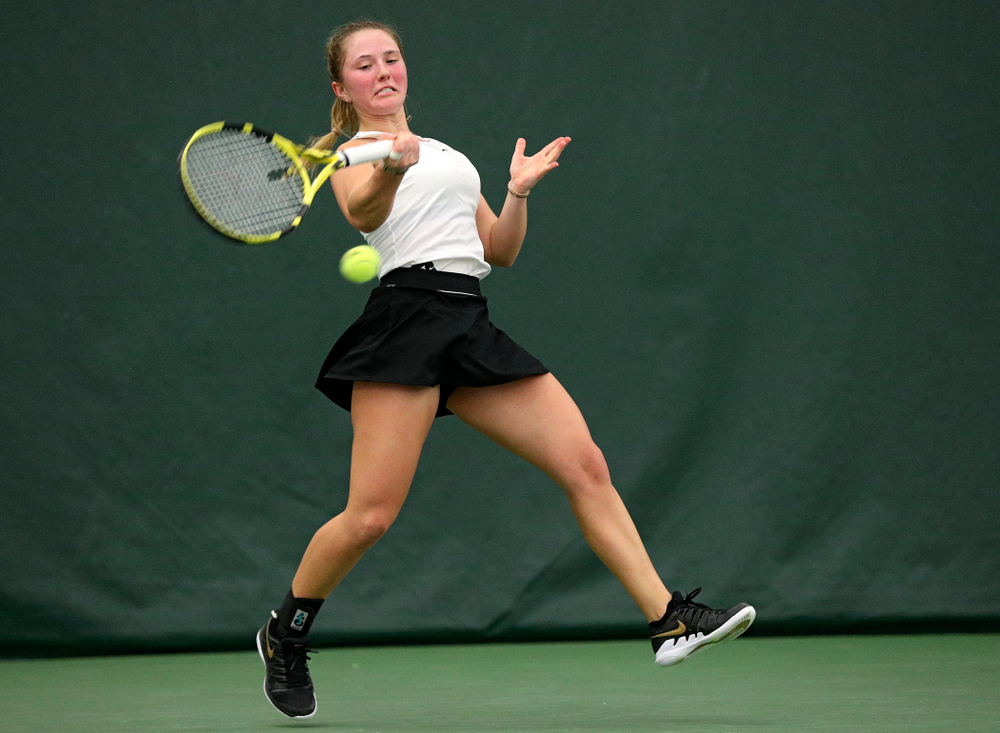 Iowa’s Danielle Burich returns a shot during her singles match at the Hawkeye Tennis and Recreation Complex in Iowa City on Sunday, February 16, 2020. (Stephen Mally/hawkeyesports.com)