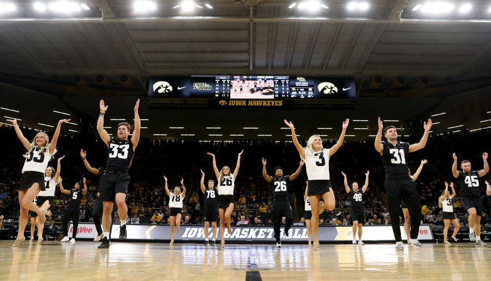Members of the Hawkeye Football team performs with the Iowa Dance Team at halftime of the Iowa Hawkeyes game against the Ohio State Buckeyes Thursday, February 20, 2020 at Carver-Hawkeye Arena. (Brian Ray/hawkeyesports.com)
