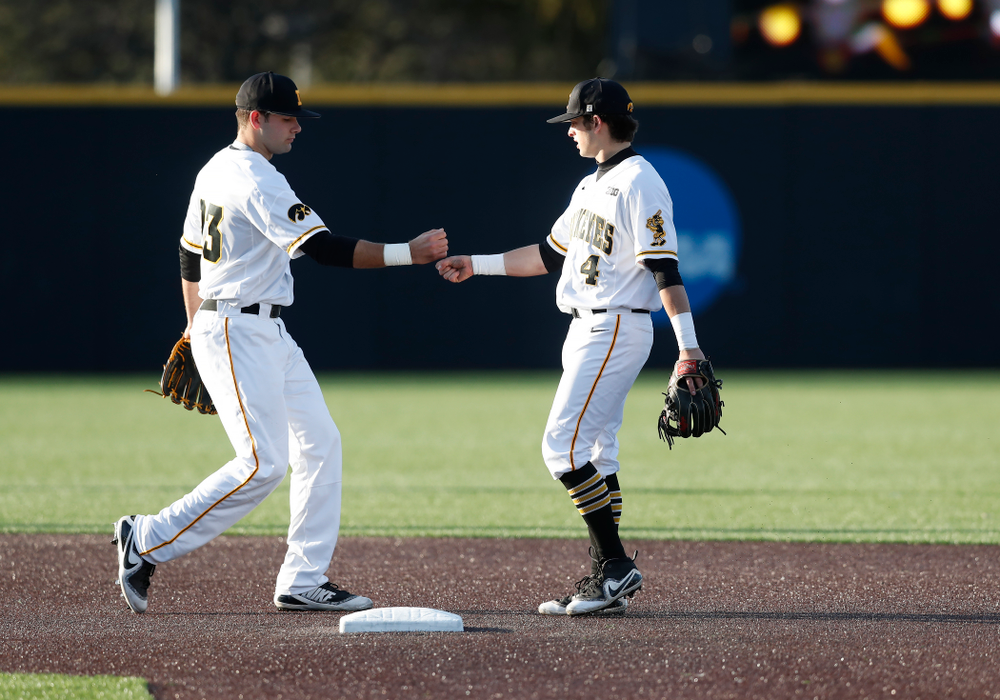 Iowa Hawkeyes infielder Kyle Crowl (23) and infielder Mitchell Boe (4) against Northern Illinois Tuesday, April 17, 2018 at Duane Banks Field. (Brian Ray/hawkeyesports.com)