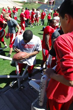 Lobo standout Donovan Porterie signs an autograph Saturday after the game.