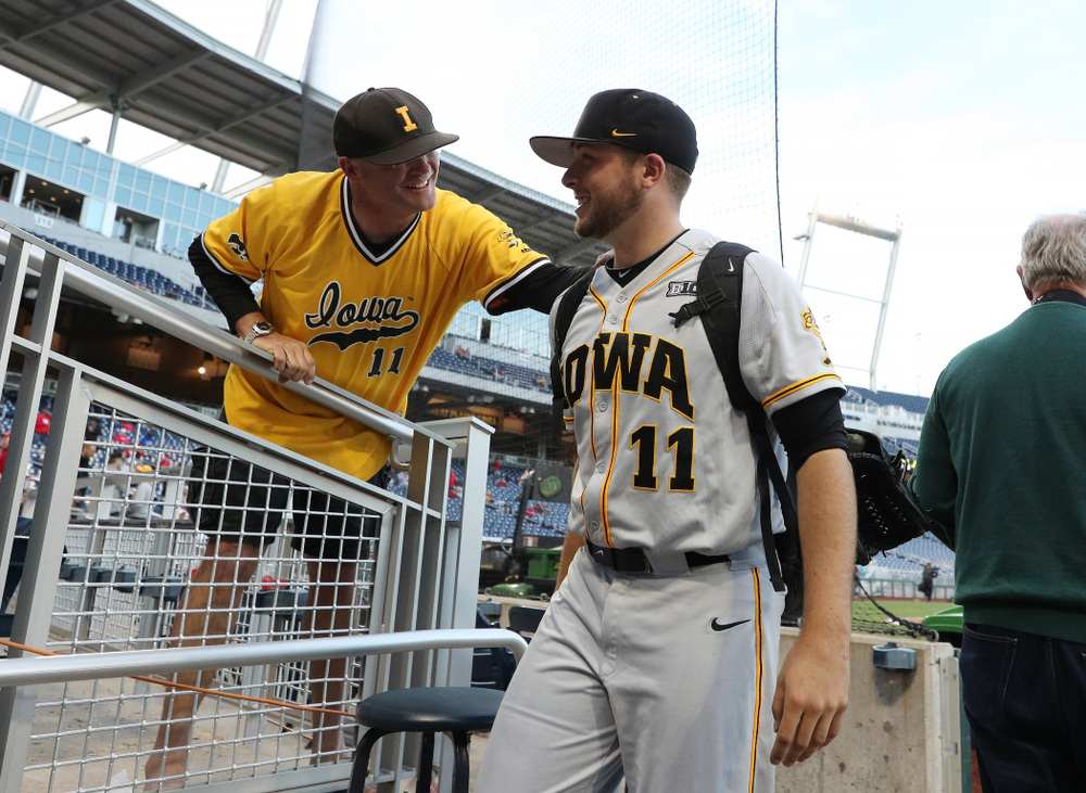 Iowa Hawkeyes Cole McDonald (11) hugs his father after getting the win against the Indiana Hoosiers in the first round of the Big Ten Baseball Tournament Wednesday, May 22, 2019 at TD Ameritrade Park in Omaha, Neb. (Brian Ray/hawkeyesports.com)
