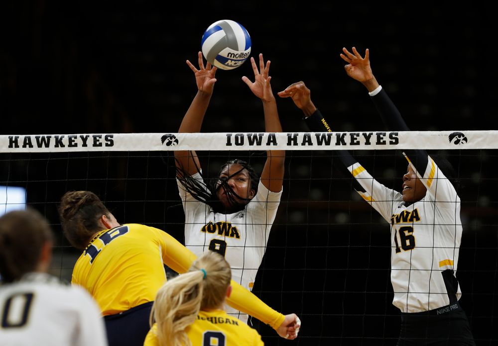 Iowa Hawkeyes middle blocker Amiya Jones (9) and outside hitter Taylor Louis (16) against the Michigan Wolverines Sunday, September 23, 2018 at Carver-Hawkeye Arena. (Brian Ray/hawkeyesports.com)