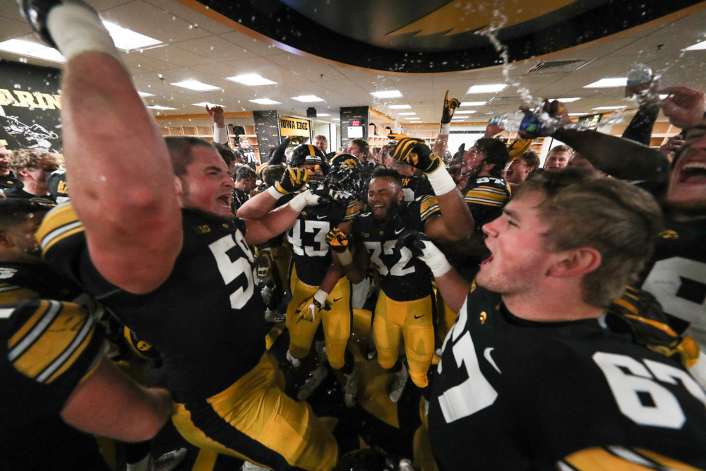 The Iowa Hawkeyes celebrate in the locker room following their game against the Nebraska Cornhuskers Friday, November 23, 2018 at Kinnick Stadium. (Brian Ray/hawkeyesports.com)