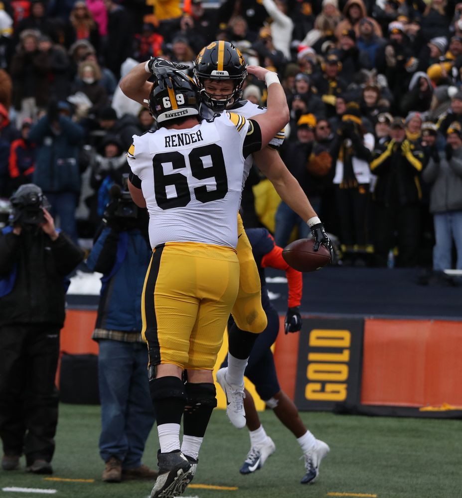 Iowa Hawkeyes tight end T.J. Hockenson (38) and offensive lineman Keegan Render (69) against the Illinois Fighting Illini Saturday, November 17, 2018 at Memorial Stadium in Champaign, Ill. (Brian Ray/hawkeyesports.com)