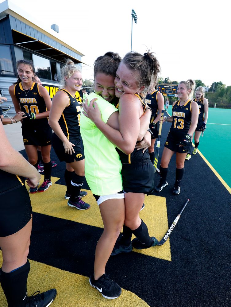 Iowa Hawkeyes Maddy Murphy (26) hugs Grace McGuire (62) following their game against the Penn Quakers Friday, September 14, 2018 at Grant Field. (Brian Ray/hawkeyesports.com)