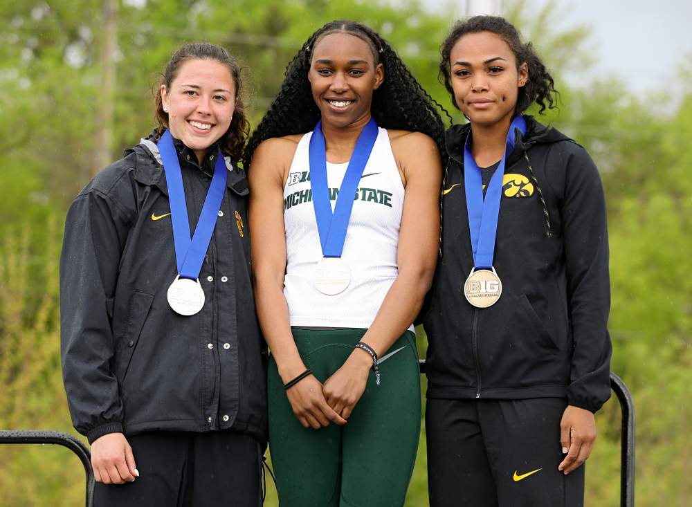 Iowa's Jenny Kimbro (left) and Tria Simmons (right) on the award stand after placing second and third in the heptathlon event on the second day of the Big Ten Outdoor Track and Field Championships at Francis X. Cretzmeyer Track in Iowa City on Saturday, May. 11, 2019. (Stephen Mally/hawkeyesports.com)