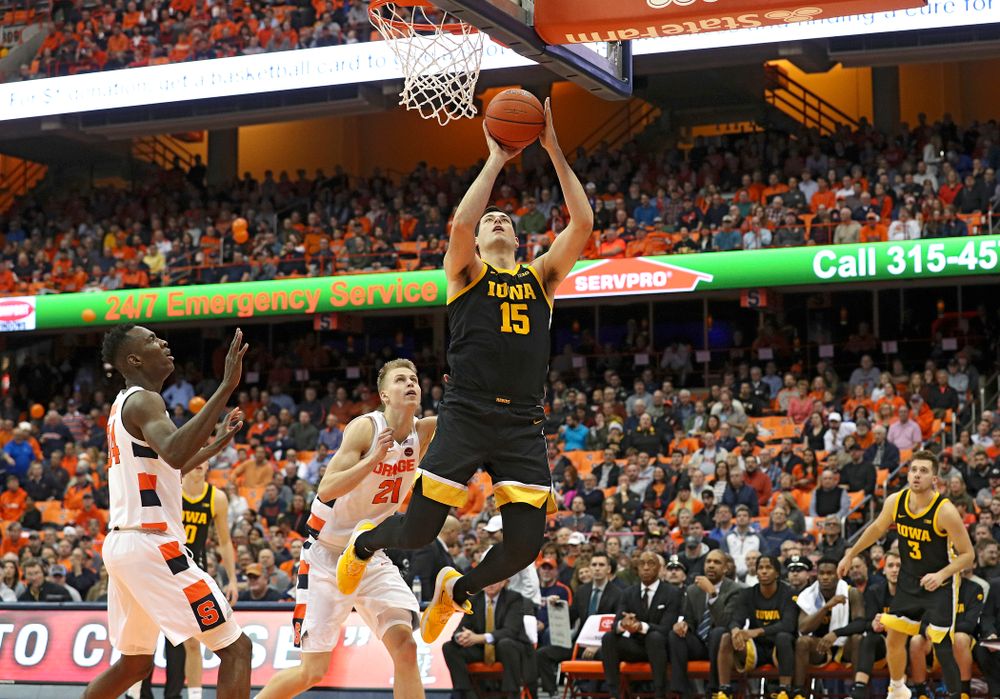 Iowa Hawkeyes forward Ryan Kriener (15) makes a basket during the second half of their ACC/Big Ten Challenge game at the Carrier Dome in Syracuse, N.Y. on Tuesday, Dec 3, 2019. (Stephen Mally/hawkeyesports.com)