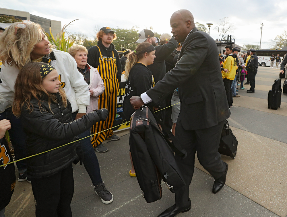 Iowa Hawkeyes wide receivers coach Kelton Copeland greets fans as he arrives with his team before their game at Kinnick Stadium in Iowa City on Saturday, Oct 19, 2019. (Stephen Mally/hawkeyesports.com)
