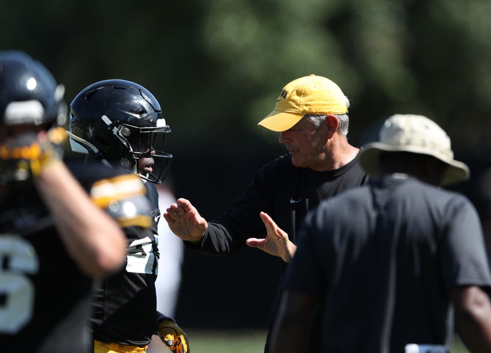 Iowa Hawkeyes head coach Kirk Ferentz and running back Shadrick Byrd (23) during Fall Camp Practice No. 5 Tuesday, August 6, 2019 at the Ronald D. and Margaret L. Kenyon Football Practice Facility. (Brian Ray/hawkeyesports.com)