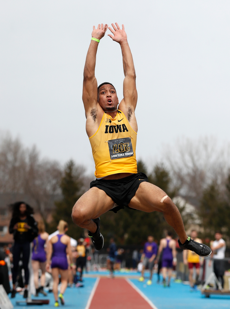 Iowa's O'Shea Wilson competes in the long jump during the 2018 MUSCO Twilight Invitational Thursday, April 12, 2018 at the Cretzmeyer Track