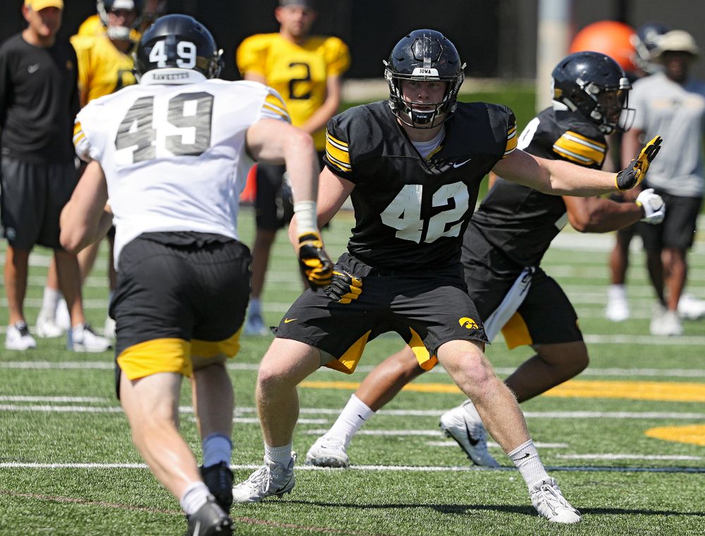 Iowa Hawkeyes tight end Shaun Beyer (42) eyes linebacker Nick Niemann (49) during Fall Camp Practice No. 7 at the Hansen Football Performance Center in Iowa City on Friday, Aug 9, 2019. (Stephen Mally/hawkeyesports.com)