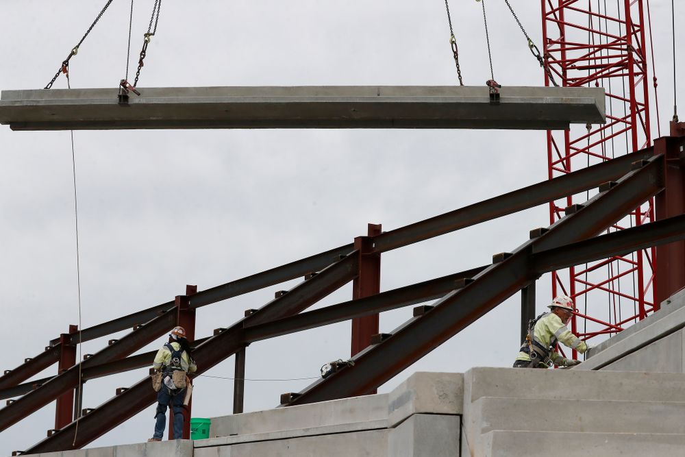 A section of precast concrete is lifted into place on the third deck of the north end zone Wednesday, June 6, 2018 at Kinnick Stadium. (Brian Ray/hawkeyesports.com)
