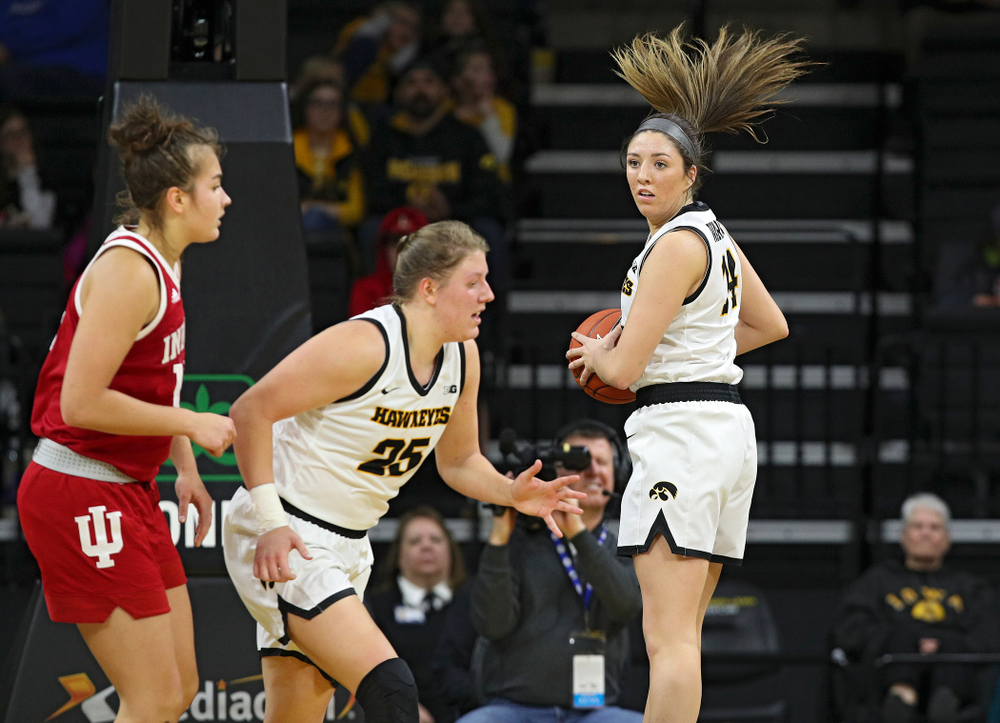 Iowa Hawkeyes guard Mckenna Warnock (14) pulls down a rebound during the second quarter of their game at Carver-Hawkeye Arena in Iowa City on Sunday, January 12, 2020. (Stephen Mally/hawkeyesports.com)