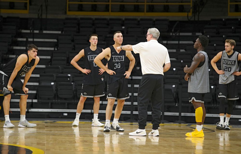 Iowa Hawkeyes head coach Fran McCaffery talks with center Luka Garza (55), guard Joe Wieskamp (10), guard Connor McCaffery (30), guard Joe Toussaint (1), and forward Riley Till (20) during practice at Carver-Hawkeye Arena in Iowa City on Monday, Sep 30, 2019. (Stephen Mally/hawkeyesports.com)