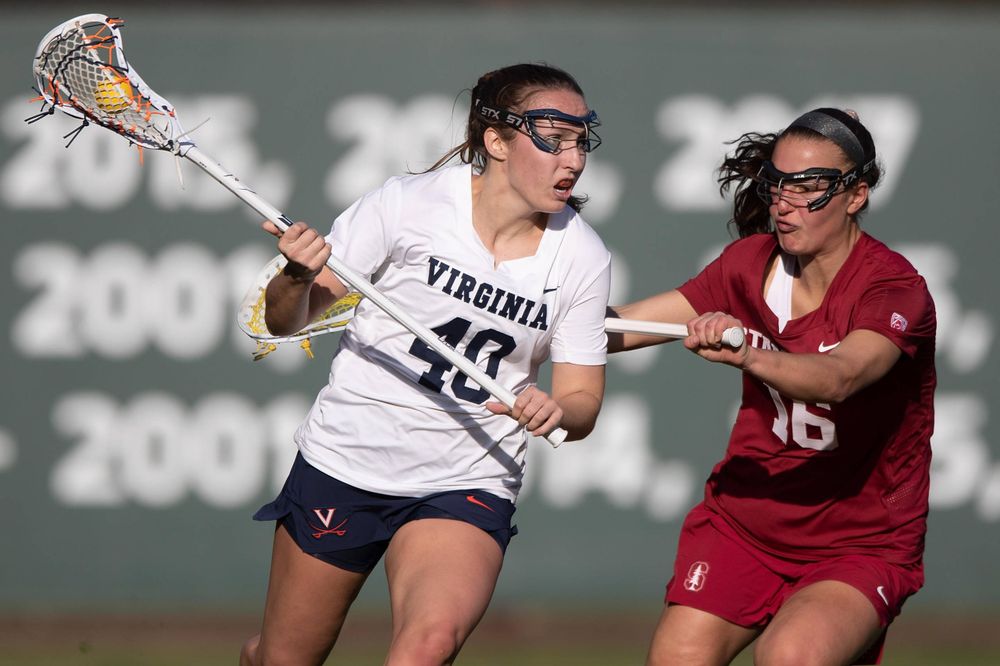 STANFORD, California - FEBRUARY 14: Virginia Cavaliers attack Olivia Schildmeyer (40) is defended by Stanford Cardinal midfield Chelsea Trattner (16) during the first half at Cagan Stadium on February 14, 2020 in Stanford, California. The Virginia Cavaliers defeated the Stanford Cardinal 12-11. (Photo by Jason O. Watson)