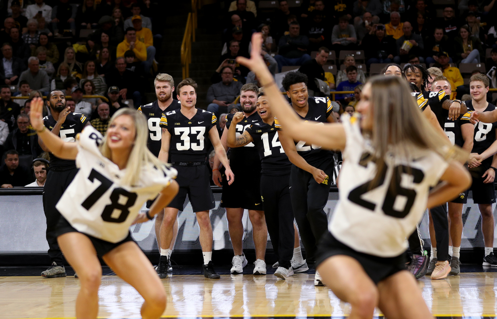 Members of the Hawkeye Football team performs with the Iowa Dance Team at halftime of the Iowa Hawkeyes game against the Ohio State Buckeyes Thursday, February 20, 2020 at Carver-Hawkeye Arena. (Brian Ray/hawkeyesports.com)