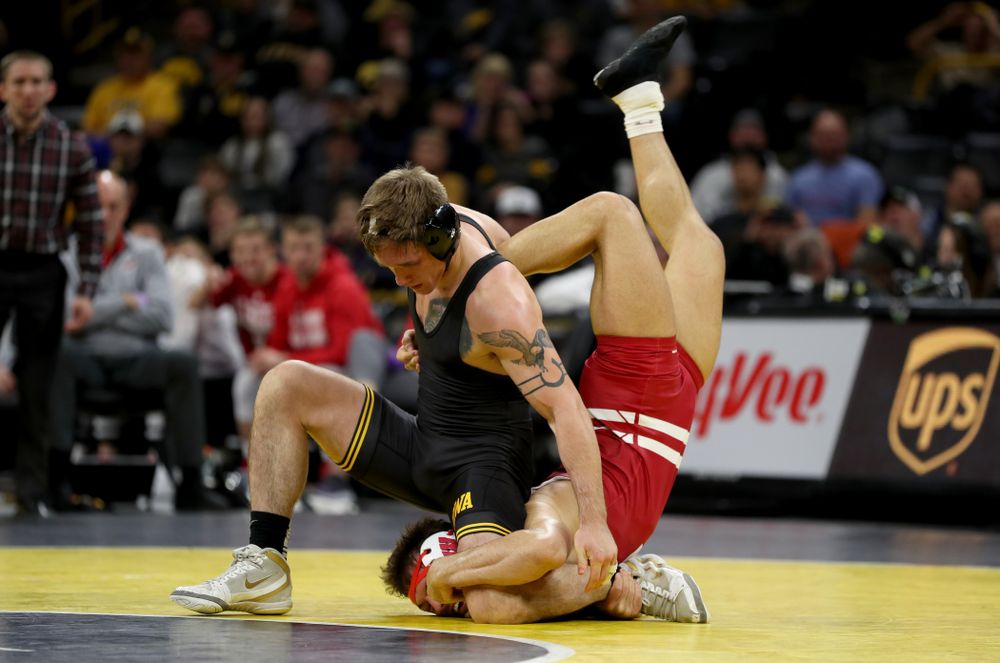 IowaÕs Cash Wilcke wrestles WisconsinÕs Johnny Sebastian at 184 pounds Sunday, December 1, 2019 at Carver-Hawkeye Arena. Sebastian won the match in overtime 7-5. (Brian Ray/hawkeyesports.com)