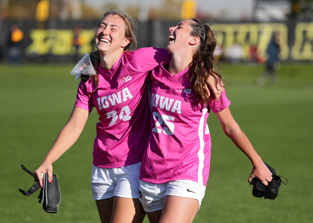 Iowa defender Sara Wheaton (24) and midfielder Josie Durr (25) are all smiles after winning their match in double overtime at the Iowa Soccer Complex in Iowa City on Sunday, Oct 27, 2019. (Stephen Mally/hawkeyesports.com)