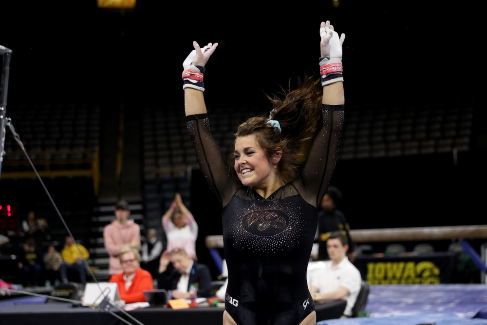 Iowa’s Erin Castle competes on the bars against Michigan Friday, February 14, 2020 at Carver-Hawkeye Arena. (Brian Ray/hawkeyesports.com)