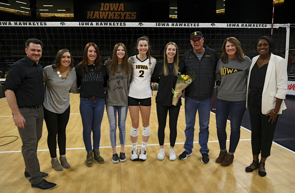 Iowa’s Meghan Buzzerio (5) is honored with her family and the coaching staff on Senior Day before their match at Carver-Hawkeye Arena in Iowa City on Saturday, Nov 30, 2019. (Stephen Mally/hawkeyesports.com)