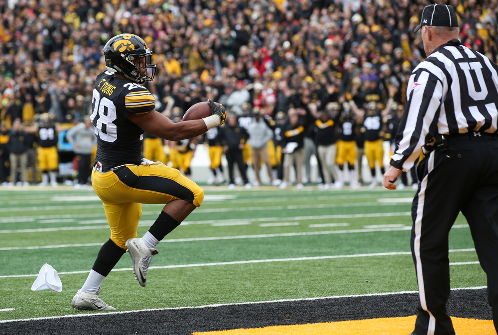 Iowa Hawkeyes running back Toren Young (28) runs the ball for a touchdown during a game against Nebraska at Kinnick Stadium on November 23, 2018. (Tork Mason/hawkeyesports.com)