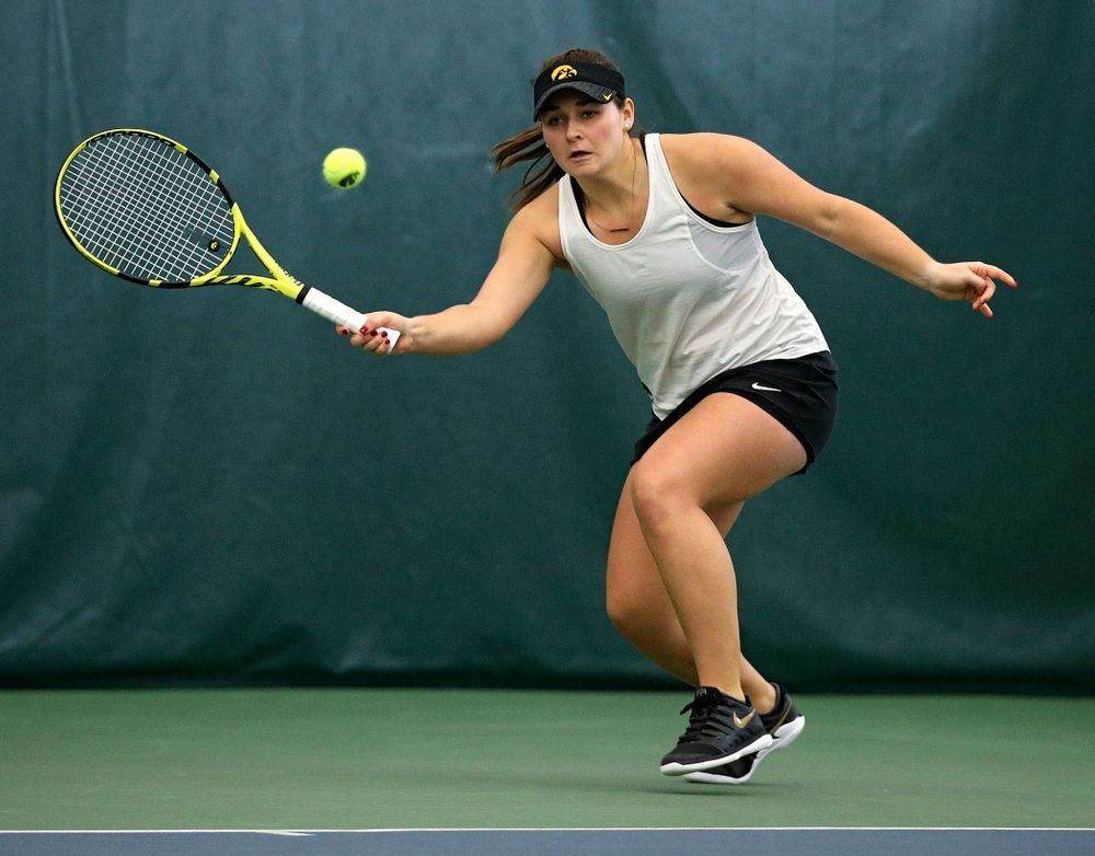 Iowa’s Danielle Bauers returns a shot during her doubles match at the Hawkeye Tennis and Recreation Complex in Iowa City on Sunday, February 23, 2020. (Stephen Mally/hawkeyesports.com)