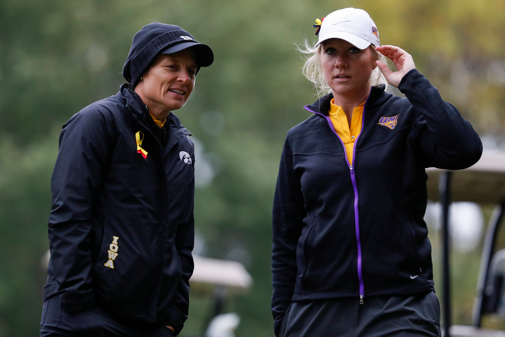 Iowa head coach Megan Menzel and Northern Iowa assistant coach Jessie Sindlinger chat while watching first round action during the Diane Thomason Invitational at Finkbine Golf Course on September 29, 2018. (Tork Mason/hawkeyesports.com)
