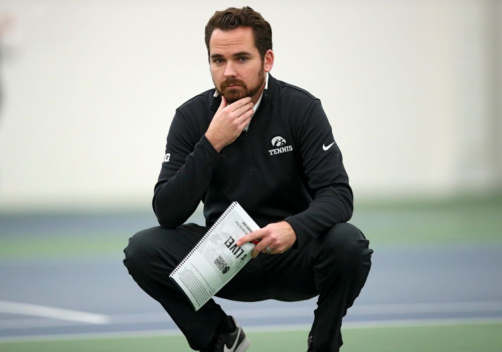 Iowa head coach Ross Wilson looks on during their match at the Hawkeye Tennis and Recreation Complex in Iowa City on Thursday, January 16, 2020. (Stephen Mally/hawkeyesports.com)