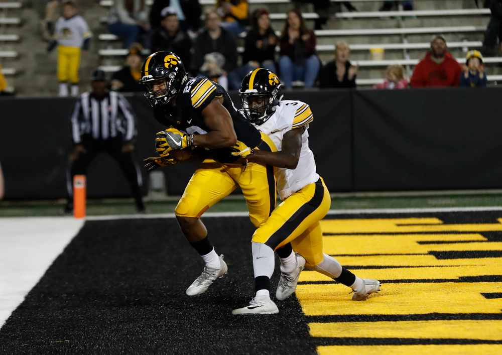 Iowa Hawkeyes wide receiver Dominique Dafney (23) and defensive back Trey Creamer (3) during their final spring practice Friday, April 20, 2018 at Kinnick Stadium. (Brian Ray/hawkeyesports.com)