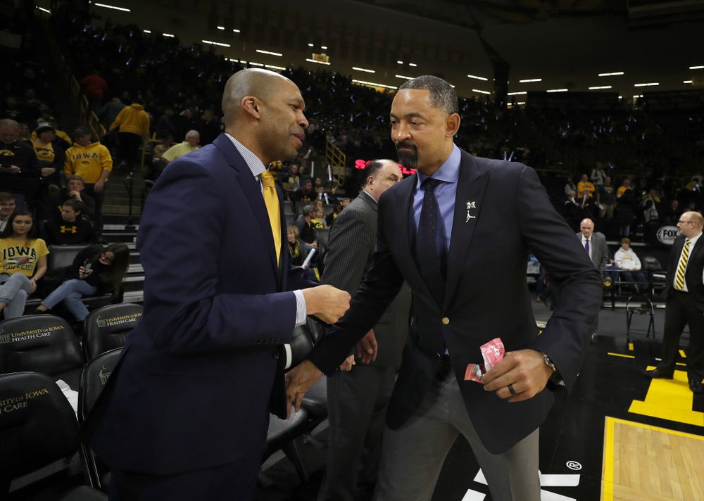 Iowa Hawkeyes assistant coach Billy Taylor and Michigan Wolverines head coach Juwan Howard Friday, January 17, 2020 at Carver-Hawkeye Arena. (Brian Ray/hawkeyesports.com)