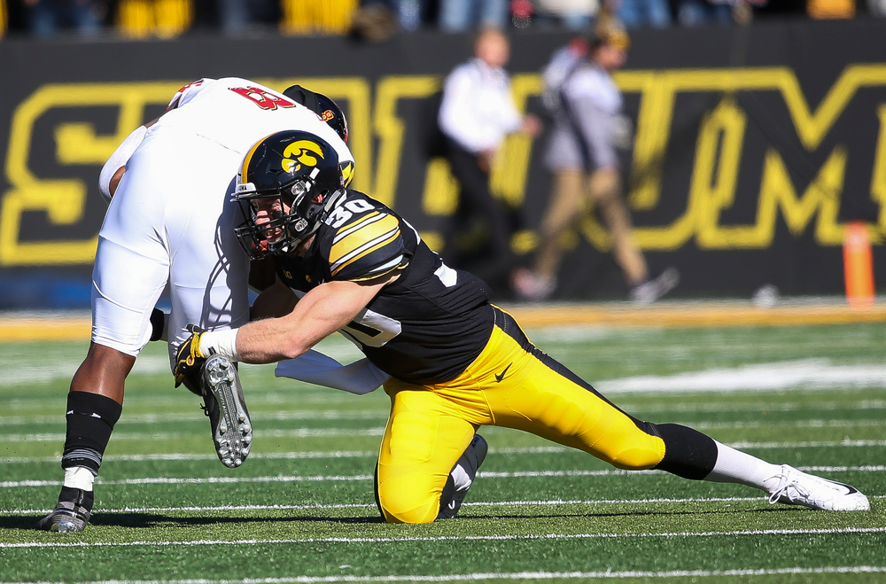 Iowa Hawkeyes defensive back Jake Gervase (30) makes a tackle during a game against Maryland at Kinnick Stadium on October 20, 2018. (Tork Mason/hawkeyesports.com)