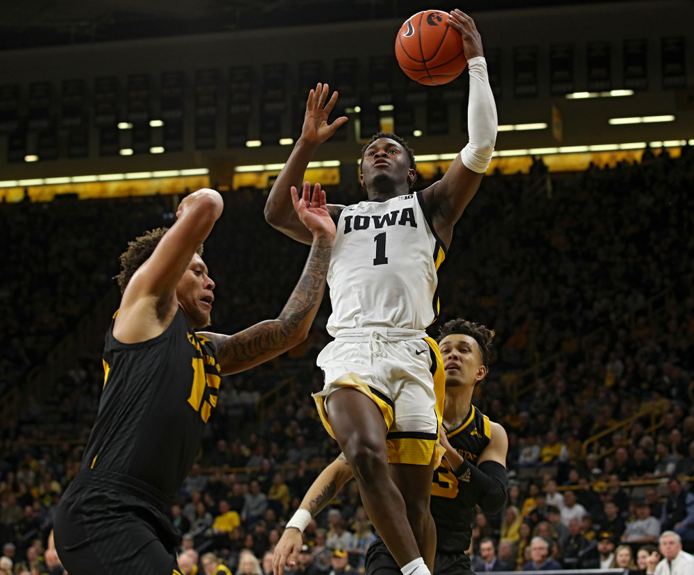 Iowa Hawkeyes guard Joe Toussaint (1) puts up a shot during the first half of their their game at Carver-Hawkeye Arena in Iowa City on Sunday, December 29, 2019. (Stephen Mally/hawkeyesports.com)