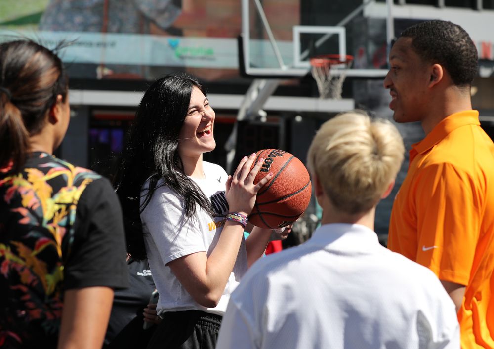 Iowa Hawkeyes forward Megan Gustafson (10) and TennesseeÕs Grant Williams during a Special Olympics event Friday, April 12, 2019 as part of the ESPN College Basketball Awards in the XBOX Plaza at LA Live. (Brian Ray/hawkeyesports.com)
