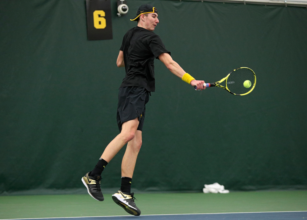 Iowa’s Nikita Snezhko returns a shot during his singles match at the Hawkeye Tennis and Recreation Complex in Iowa City on Friday, March 6, 2020. (Stephen Mally/hawkeyesports.com)