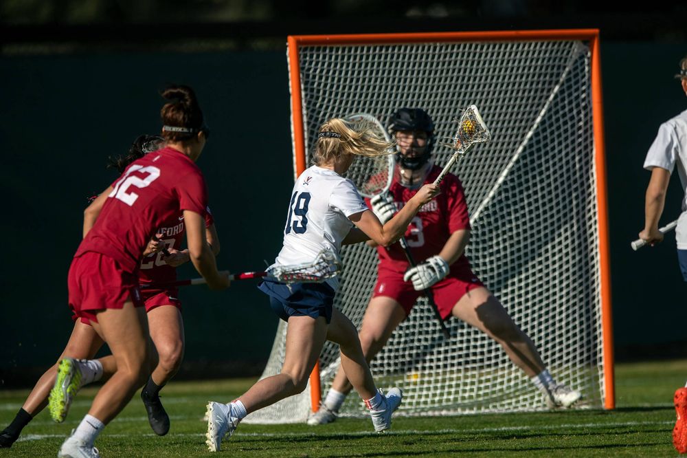 STANFORD, California - FEBRUARY 14: Virginia Cavaliers midfield Annie Dyson (19) shoots against Stanford Cardinal goalkeeper Trudie Grattan (3) during the first half at Cagan Stadium on February 14, 2020 in Stanford, California. The Virginia Cavaliers defeated the Stanford Cardinal 12-11. (Photo by Jason O. Watson)
