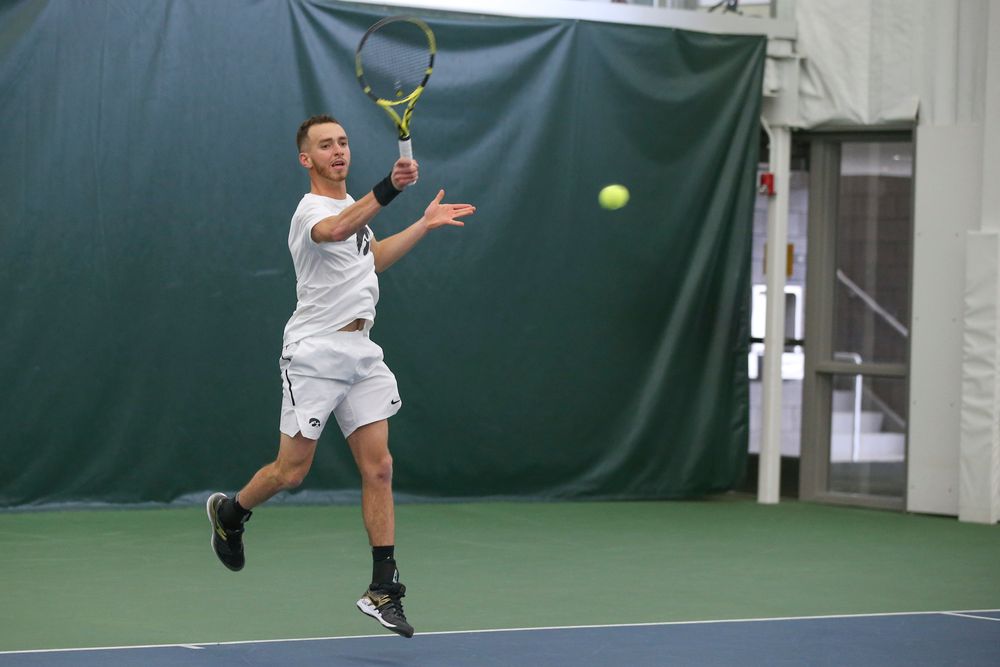 Iowa’s Kareem Allaf returns a hit during the Iowa men’s tennis meet vs Nebraska on Sunday, March 1, 2020 at the Hawkeye Tennis and Recreation Complex. (Lily Smith/hawkeyesports.com)