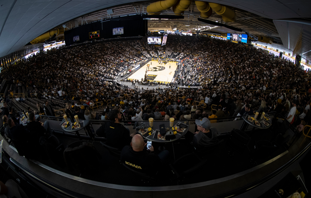 Fans sit in the terrace tables as the Iowa Hawkeyes take on the Illinois Fighting Illini Sunday, January 20