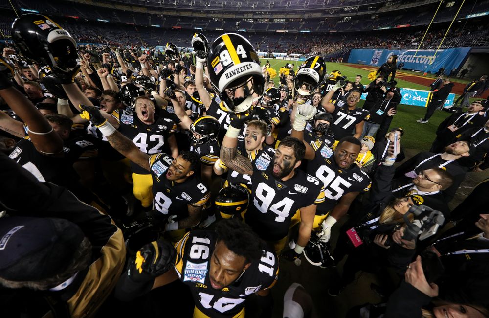 The Iowa Hawkeyes sing the Fight Song after their win against USC in the Holiday Bowl Friday, December 27, 2019 at San Diego Community Credit Union Stadium. (Brian Ray/hawkeyesports.com)