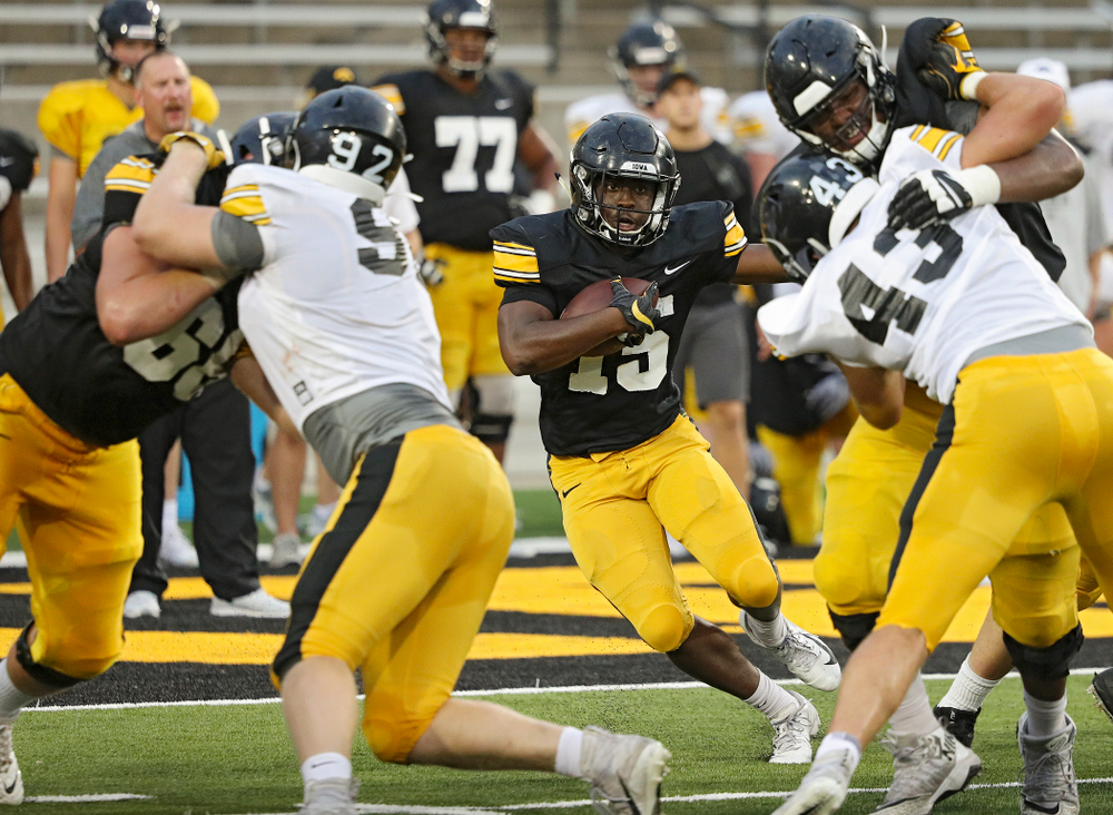 Iowa Hawkeyes running back Tyler Goodson (15) looks for running room during Fall Camp Practice No. 12 at Kinnick Stadium in Iowa City on Thursday, Aug 15, 2019. (Stephen Mally/hawkeyesports.com)