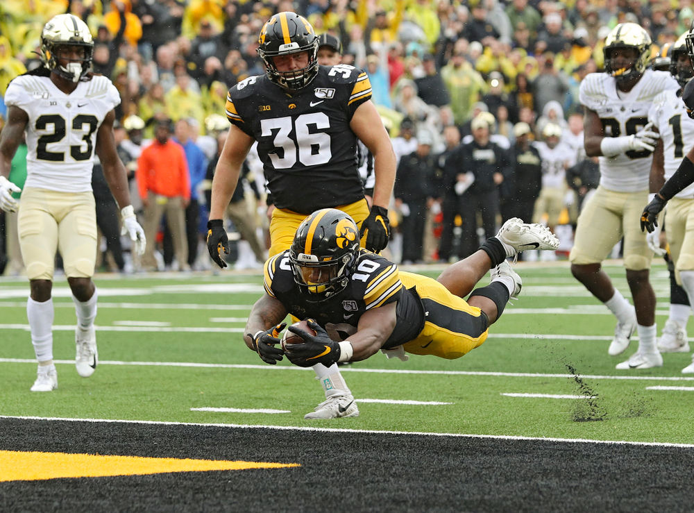 Iowa Hawkeyes running back Mekhi Sargent (10) dives into the end zone on a touchdown run during the fourth quarter of their game at Kinnick Stadium in Iowa City on Saturday, Oct 19, 2019. (Stephen Mally/hawkeyesports.com)
