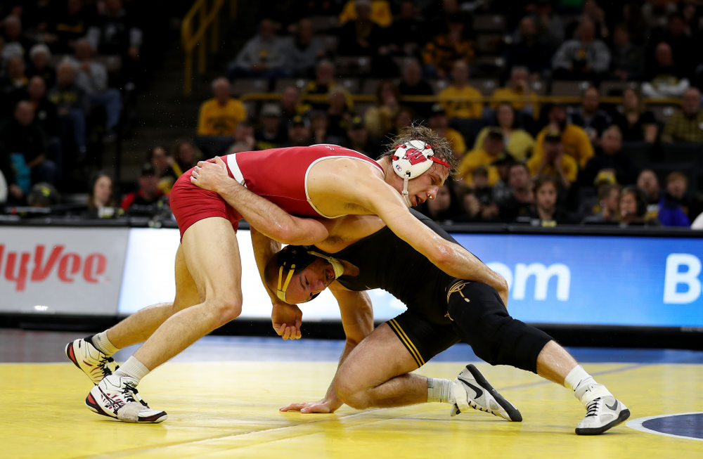 IowaÕs Alex Marinelli wrestles WisconsinÕs Evan Wick at 165 pounds Sunday, December 1, 2019 at Carver-Hawkeye Arena. Marinelli won the match 4-2. (Brian Ray/hawkeyesports.com)