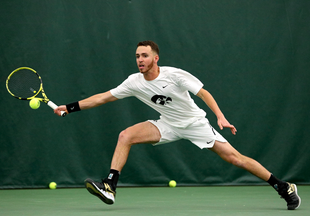 Iowa’s Kareem Allaf returns a shot during his singles match at the Hawkeye Tennis and Recreation Complex in Iowa City on Sunday, February 16, 2020. (Stephen Mally/hawkeyesports.com)