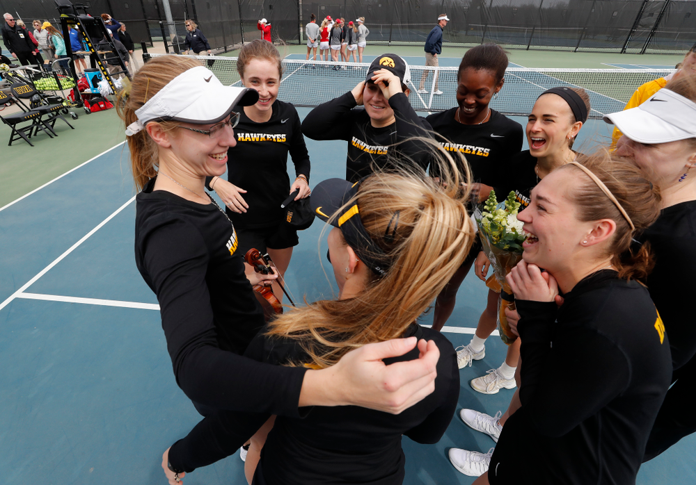 Iowa senior Montana Crawford plays the National Anthem before their match against the Wisconsin Badgers Sunday, April 22, 2018 at the Hawkeye Tennis and Recreation Center. (Brian Ray/hawkeyesports.com)