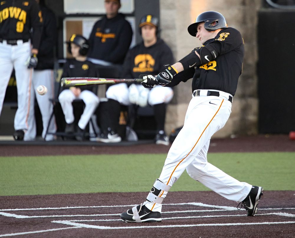 Iowa catcher Brett McCleary (32) bats during the fourth inning of their game at Duane Banks Field in Iowa City on Tuesday, March 3, 2020. (Stephen Mally/hawkeyesports.com)
