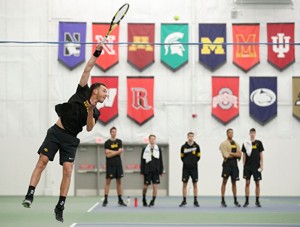 Iowa’s Kareem Allaf serves during his match against Marquette at the Hawkeye Tennis and Recreation Complex in Iowa City on Saturday, January 25, 2020. (Stephen Mally/hawkeyesports.com)